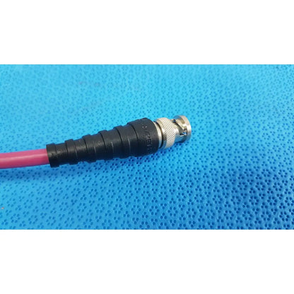 Black and silver bnc connector with threaded housing and black strain relief on pink trompefter 14949-upcwx-24-75 video patch cord