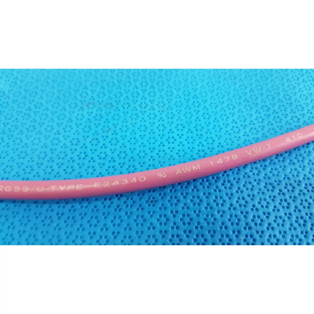 Pink insulated Trompeter 14949-PCW-24-75 ohm video patch cord showing printed specifications on the cable