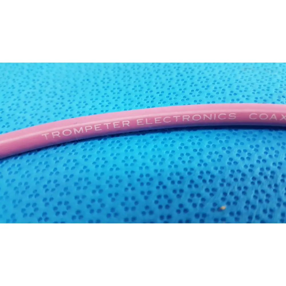 Pink coiled trompeter 14949-pcw-36-75 ohm video patch cord with trompeter electronics printed in white lettering