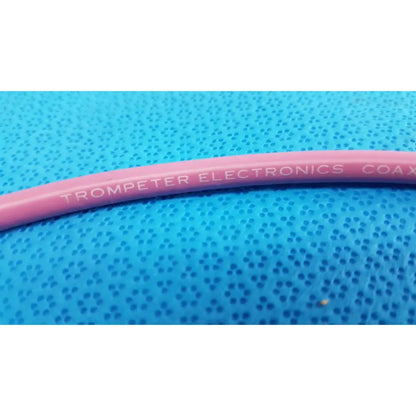 Pink coiled trompeter 14949-pcw-36-75 ohm video patch cord with trompeter electronics printed in white lettering