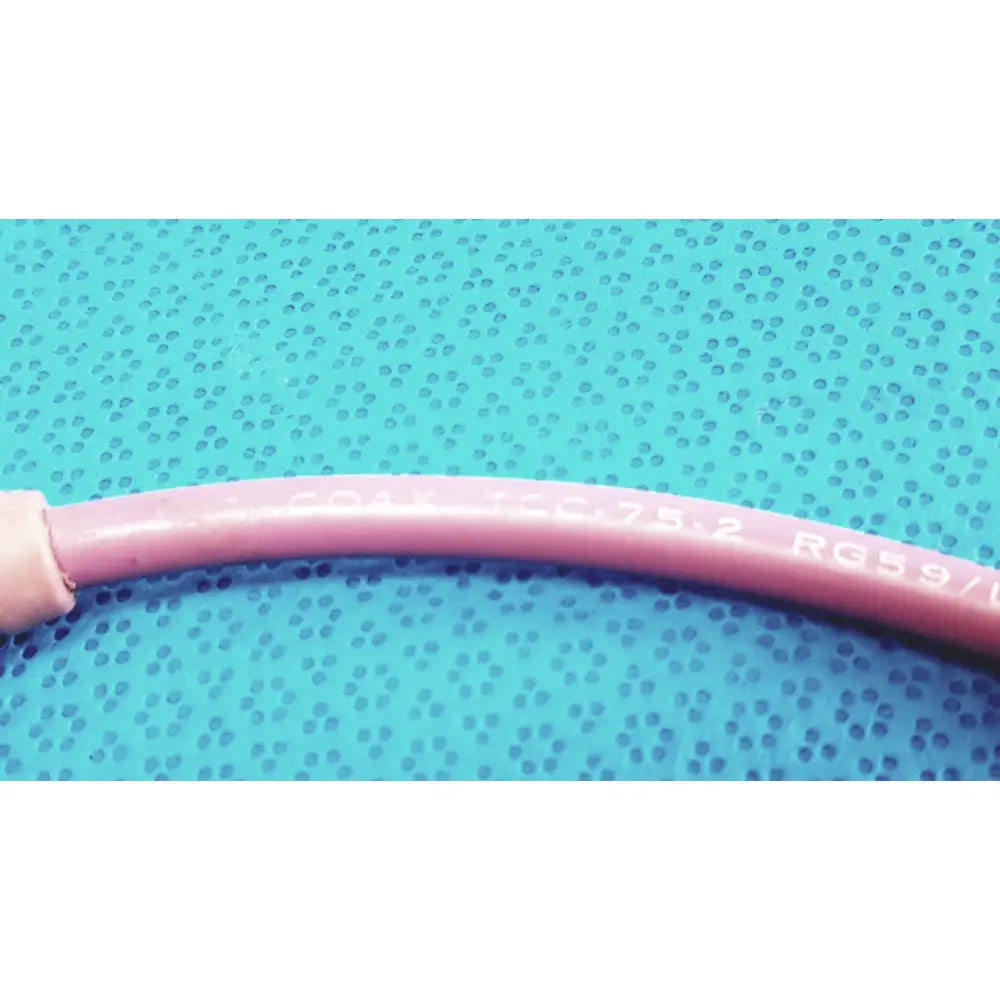 Pink insulated trompeter pink video patch cord with printed specifications 75 ohm coax cable for broadcast use
