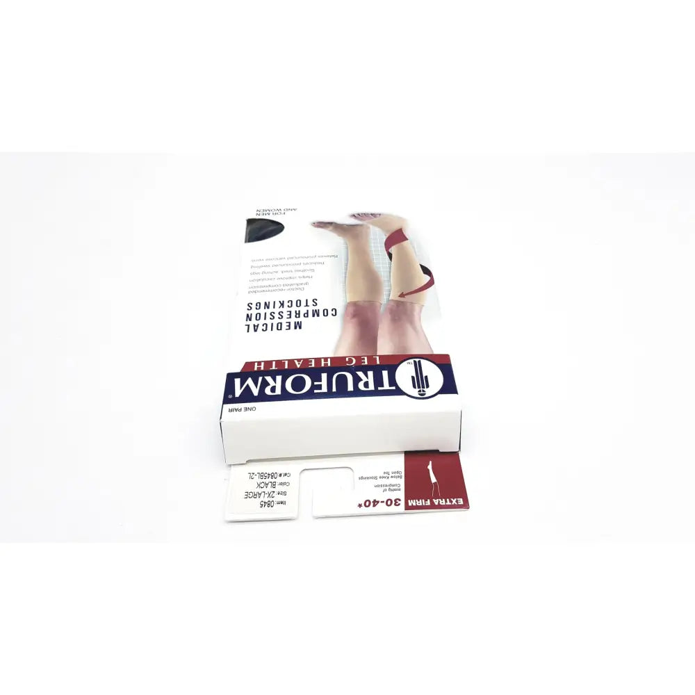 Truform leg health medical compression thigh high stockings in black with packaging showing legs wearing the product