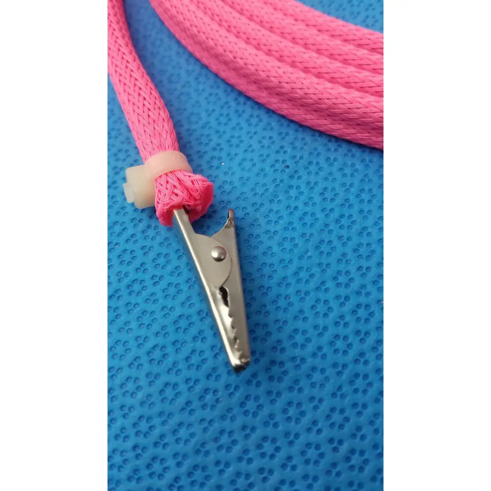 Pink braided cable with metal alligator clip and male plug designed for reuse medical applications