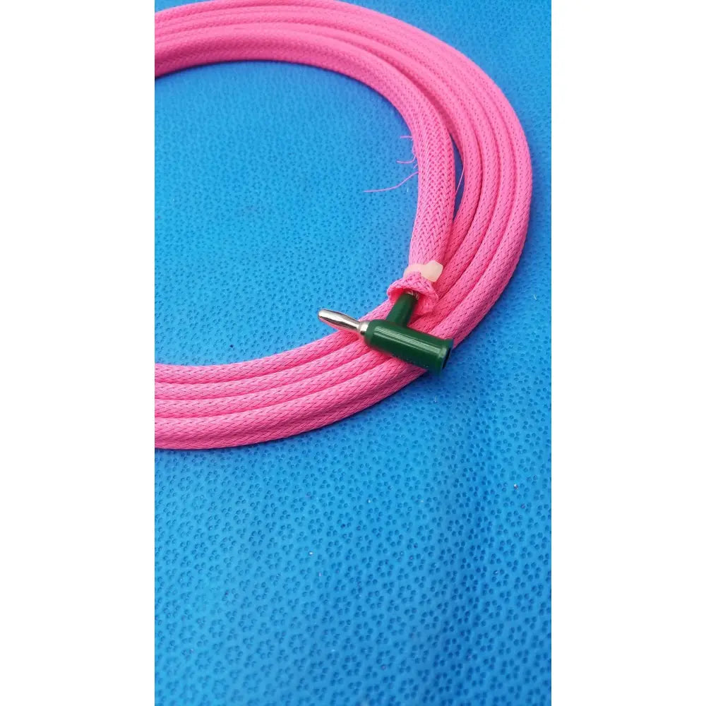 Pink braided fabric cord with green t-shaped male plug designed for reuse medical pink cable applications