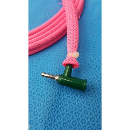 Pink braided cable with green t-shaped connector and metallic male plug for reuse medical applications