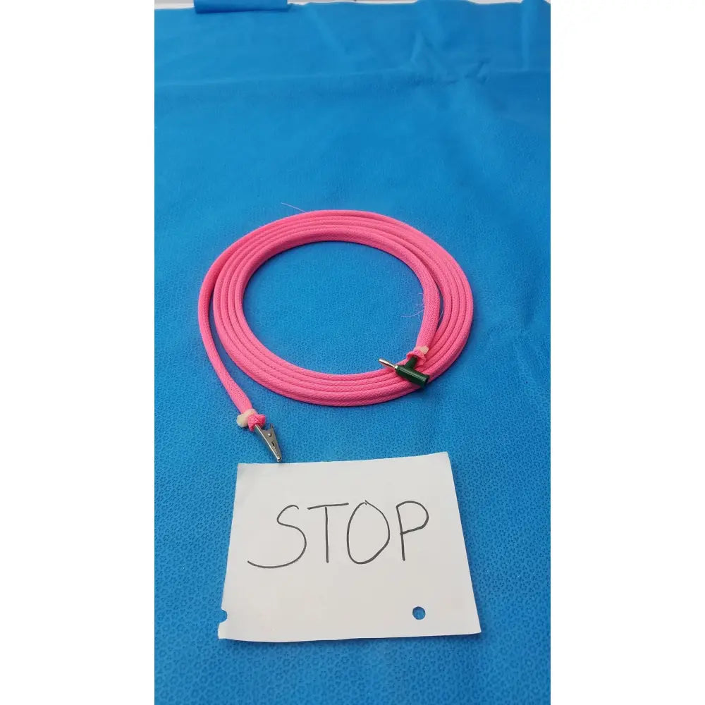 Pink braided cable with metallic alligator clips and male plug designed for reuse medical applications