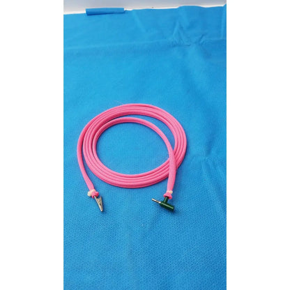 Two sides pink cable with a metal alligator clip and green male plug for reuse medical applications