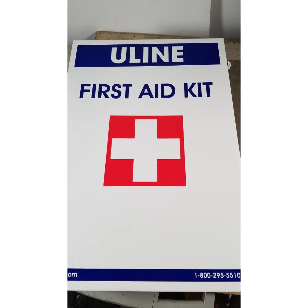 White uline h-5951 3-shelf aid cabinet with red and white cross emblem for first aid storage and organization