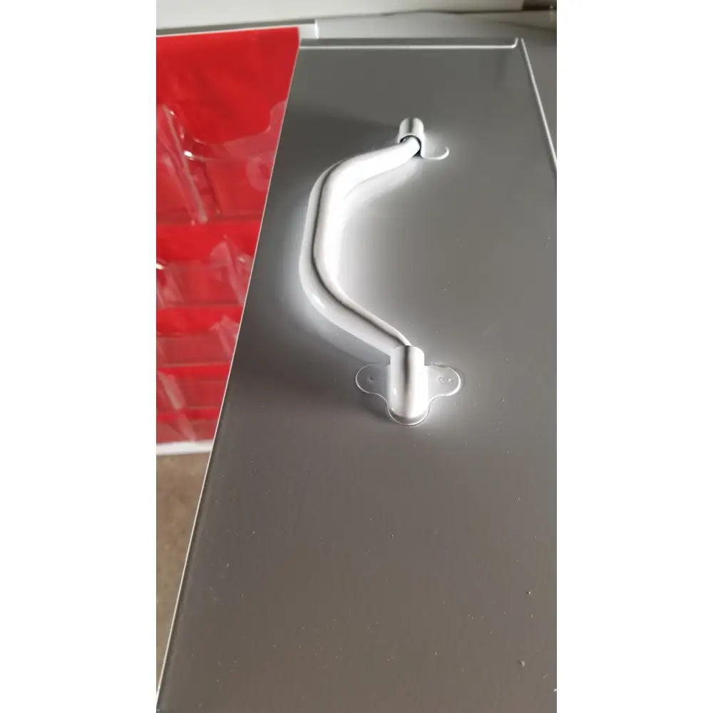 Silver metallic handle with curved ergonomic design on gray metal uline h-5951 3-shelf aid cabinet
