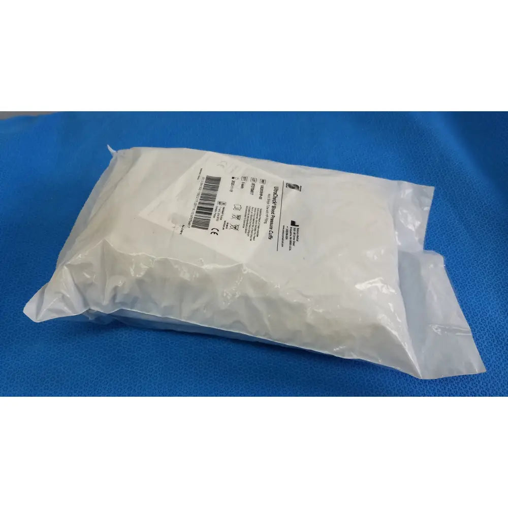 A white plastic bag containing a sterile ultracheck blood pressure cuff adult single tube with HP fitting and barcode label