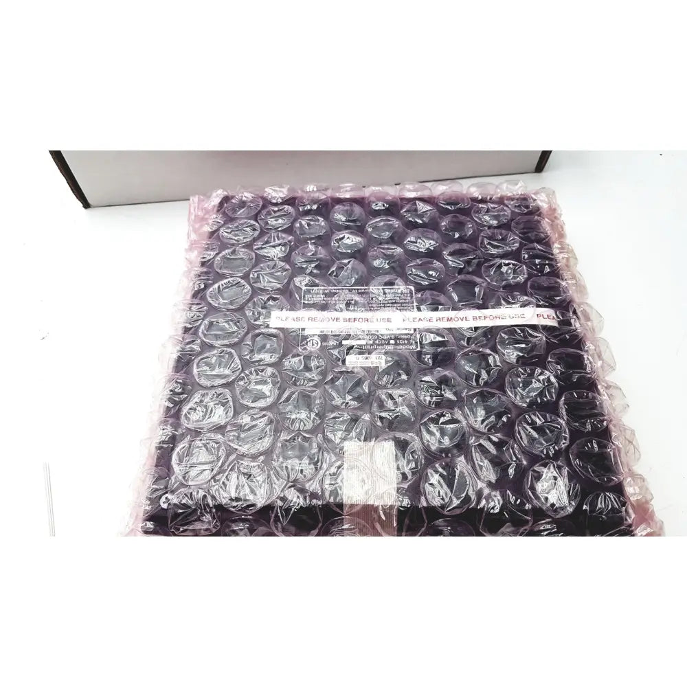Black ultratec superprint 4425 e-turbo telephone printer tty wrapped in clear bubble wrap for protection