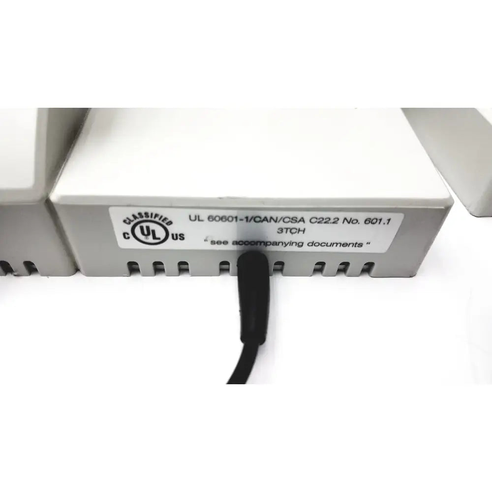 Gray plastic ulvac air compressor unit model for industrial application with black cable and certification label visible