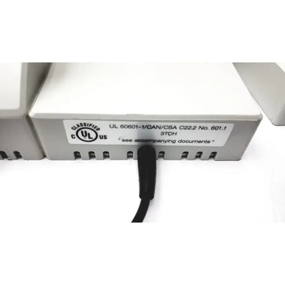 Gray plastic ulvac air compressor unit model for industrial application with black cable and certification label visible