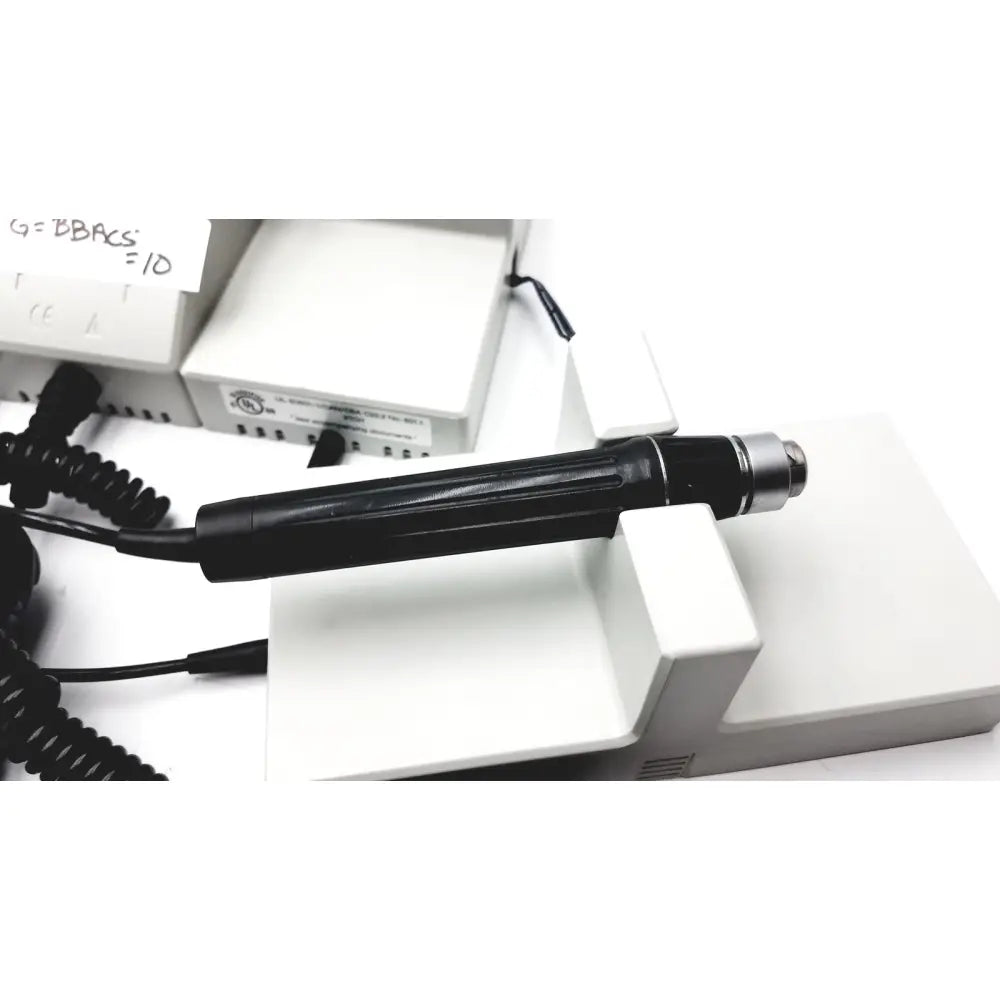 Black handheld dental drill with metallic silver tip and textured grip for ulvac air compressor unit model industrial use