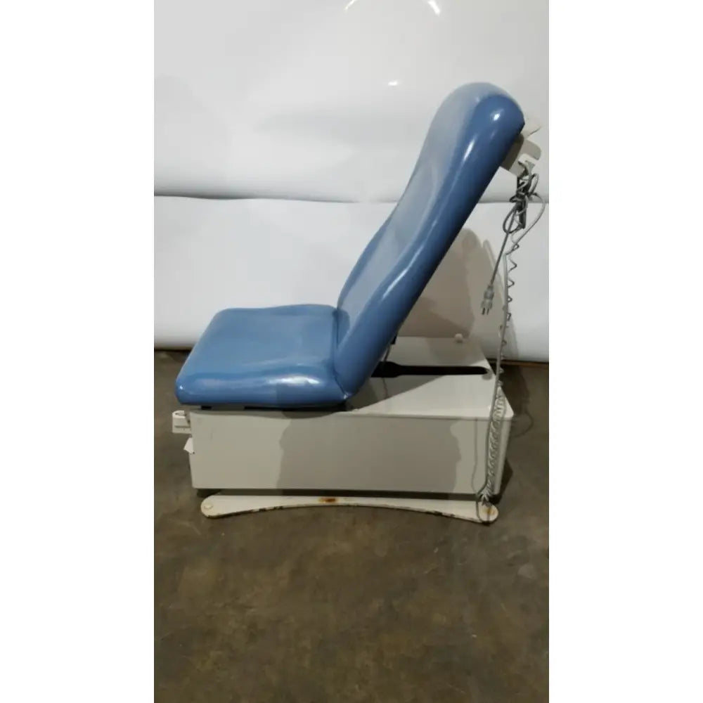 Umf 4070 power table medical examination chair in blue vinyl with white metal base and adjustable headrest with hand control