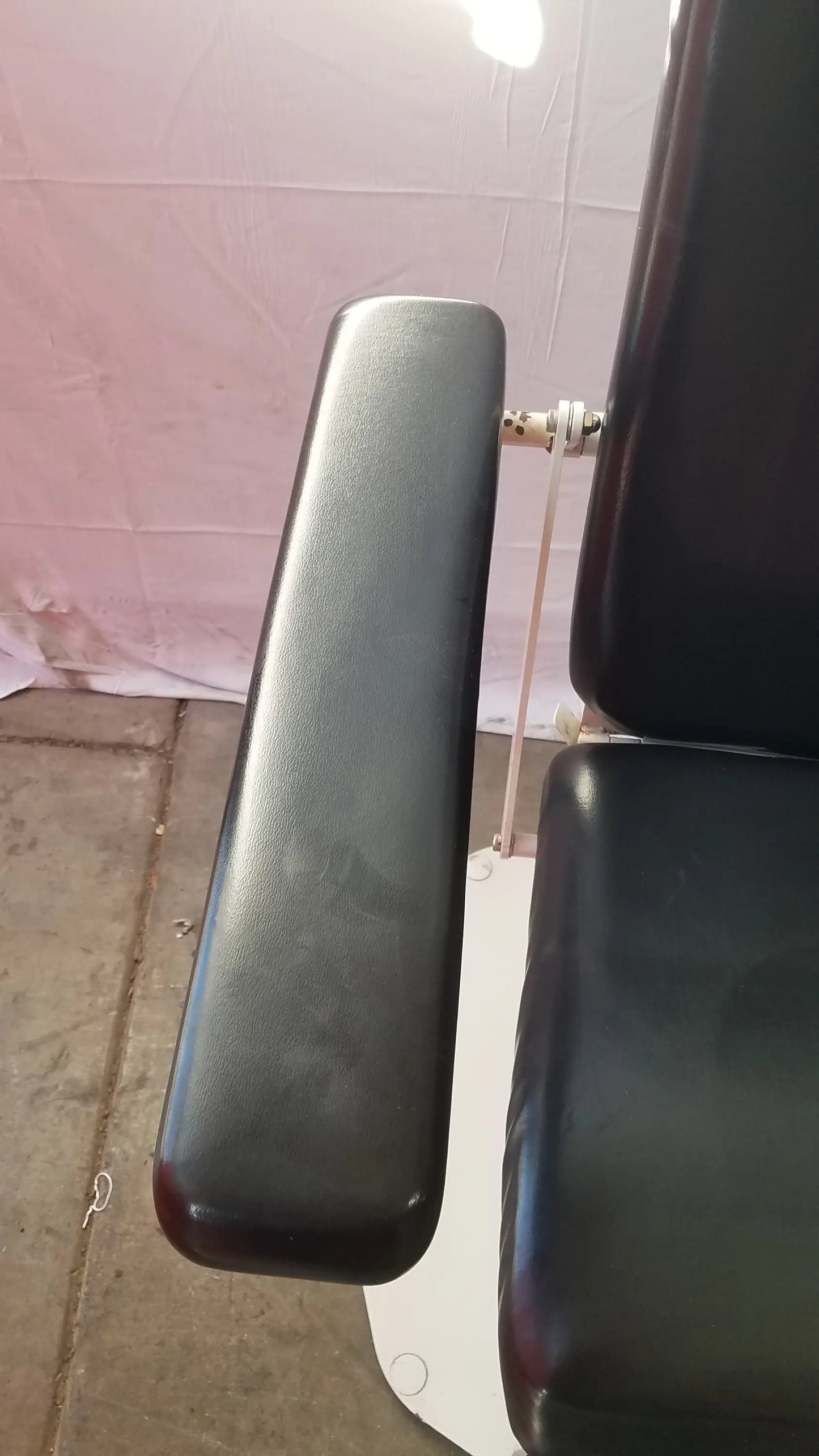 Black leather armrest of umf medical 8675 adjustable phlebotomy chair showcasing comfort and durability