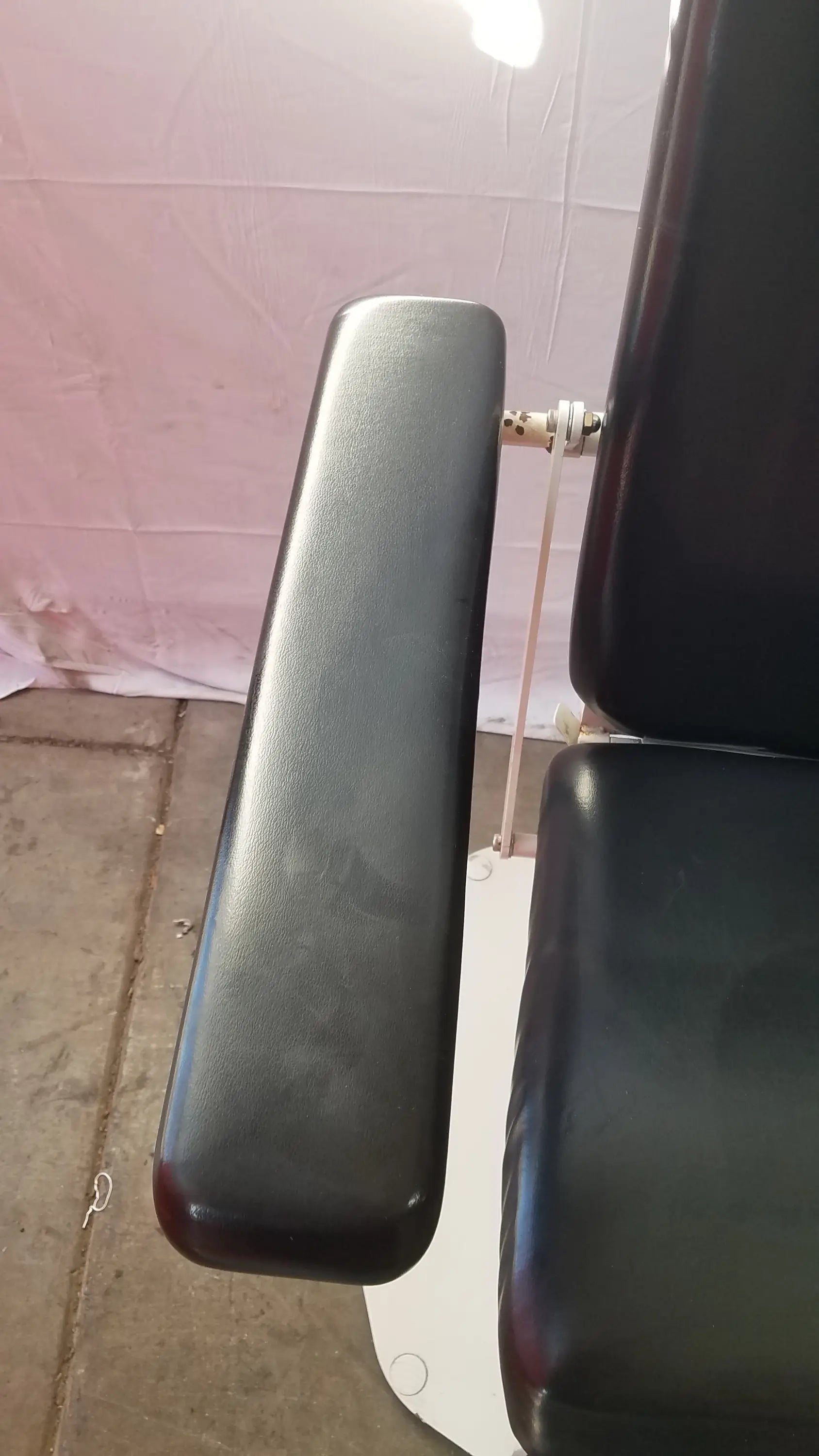 Black leather armrest of umf medical 8675 adjustable phlebotomy chair showcasing comfort and durability