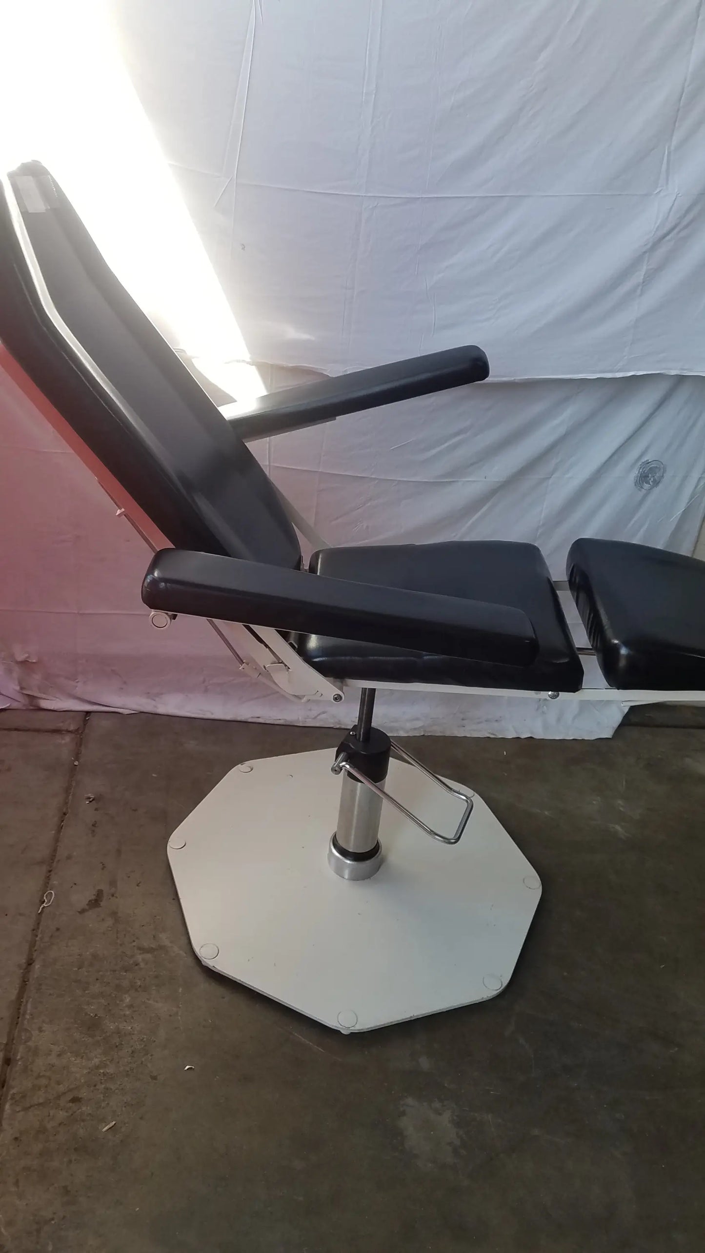 Umf medical 8675 black leather adjustable phlebotomy chair with white octagonal base and chrome adjustment mechanism