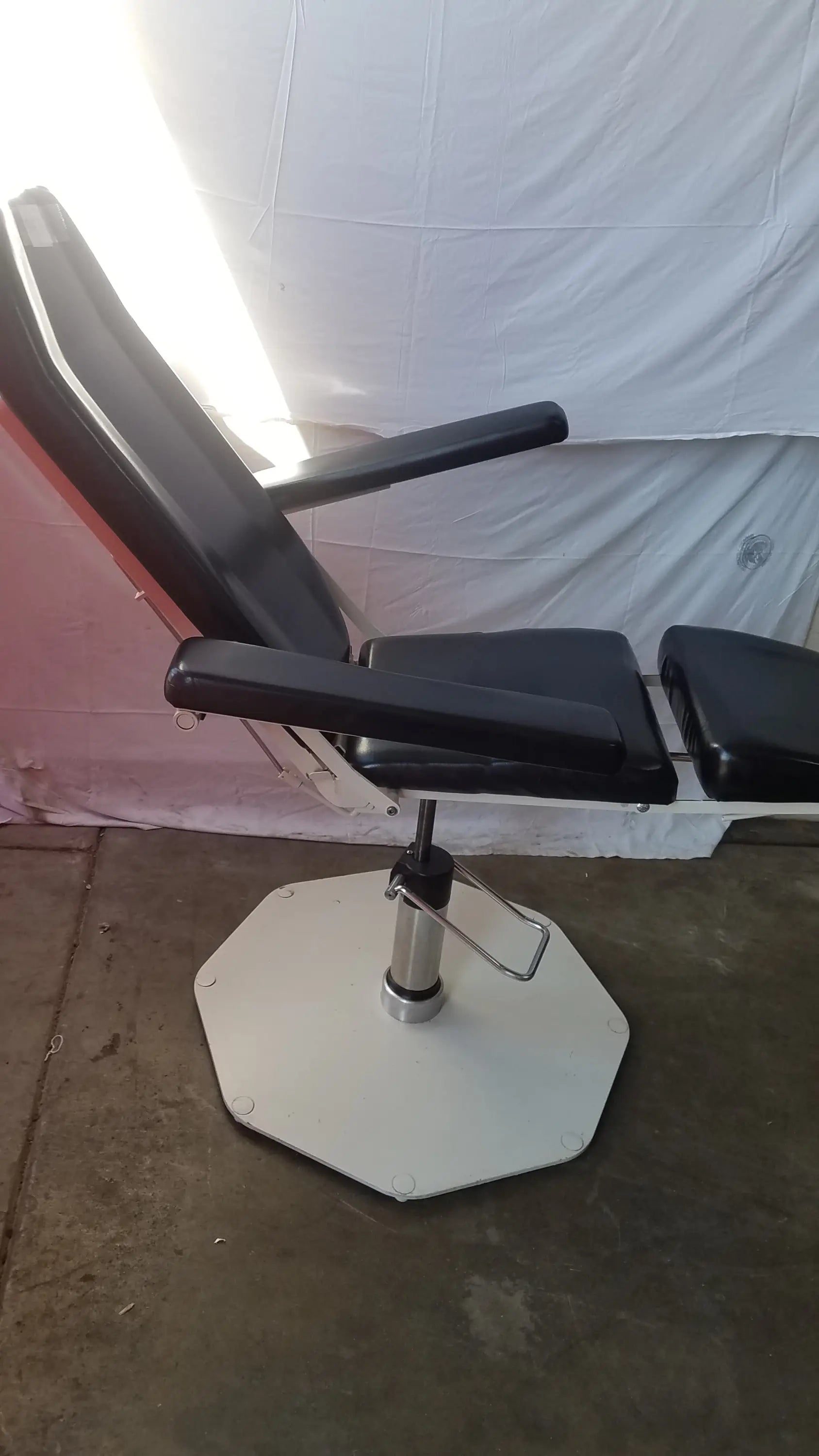 Umf medical 8675 black leather adjustable phlebotomy chair with white octagonal base and chrome adjustment mechanism
