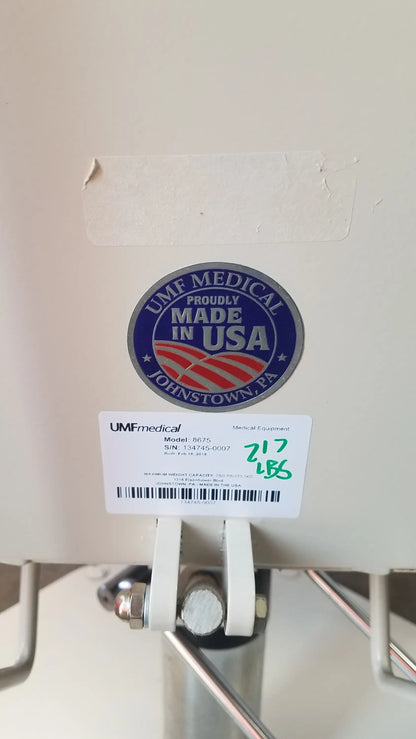 White umf medical 8675 adjustable phlebotomy chair with blue and red proudly made in usa sticker on medical equipment