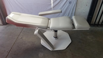 Adjustable phlebotomy chair UMF Medical 8675 with beige padded sections and white metal base for medical examination