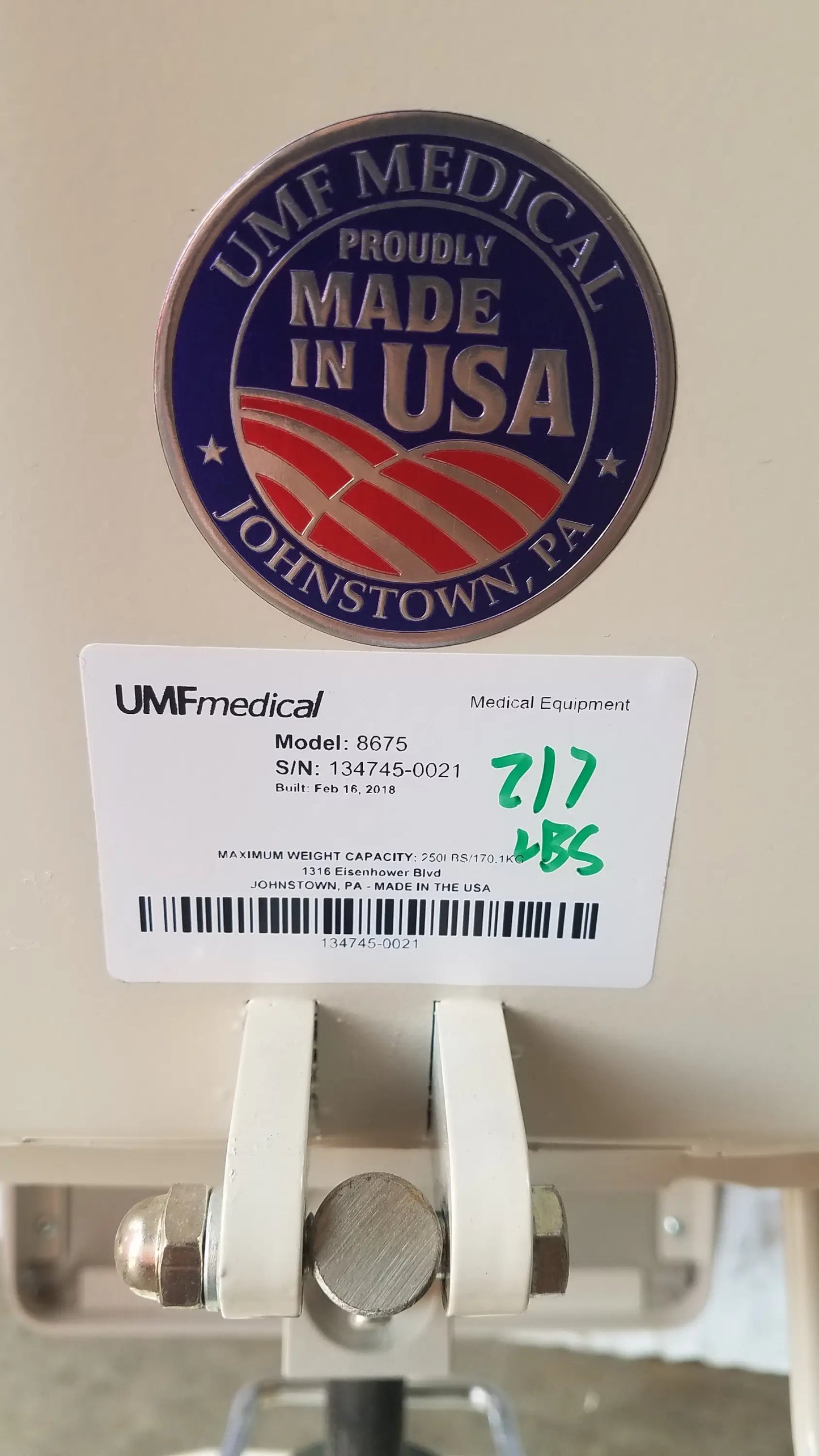 Beige umf medical 8675 adjustable phlebotomy chair with usa emblem and label showing serial number and weight capacity