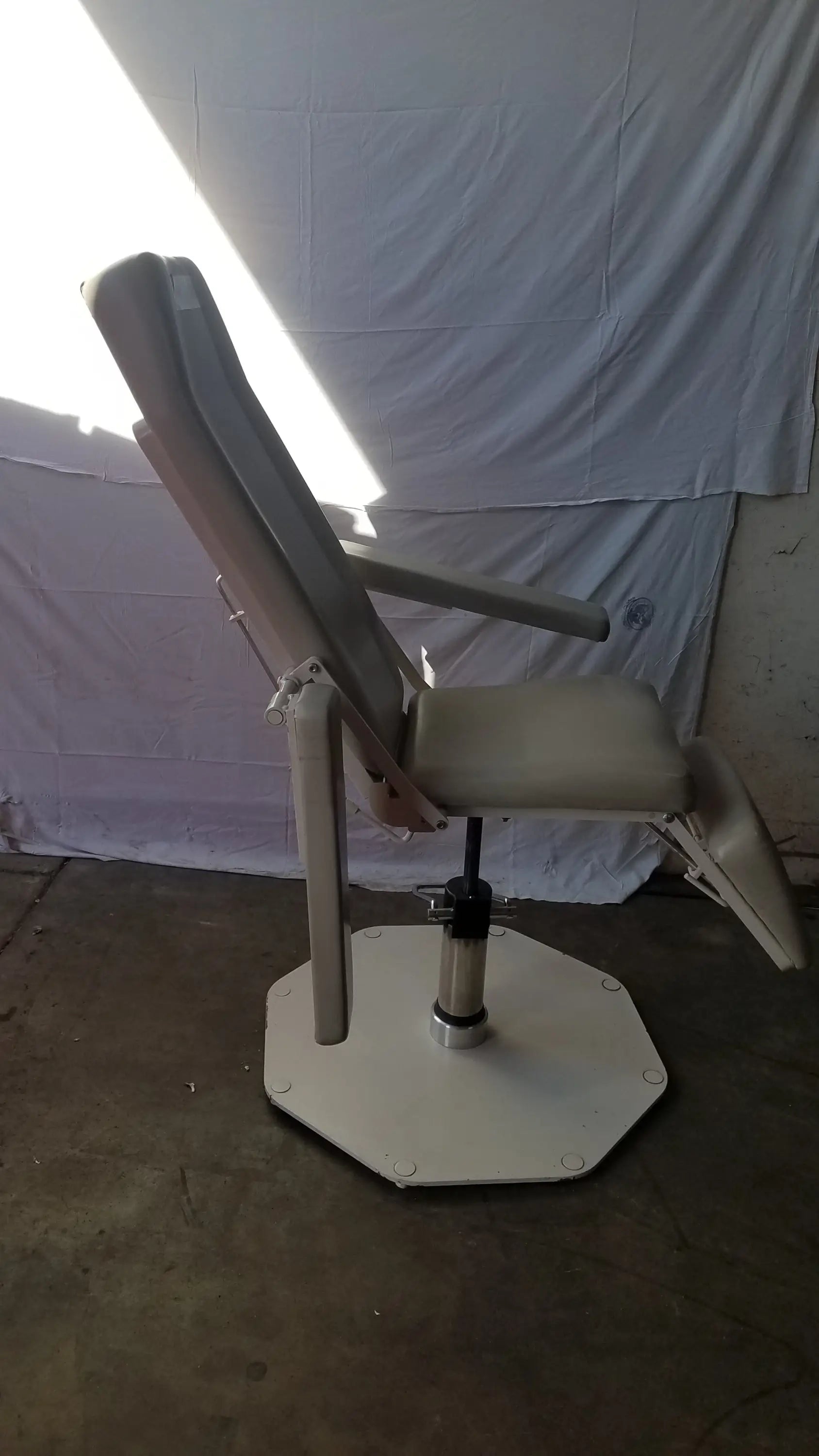 Beige upholstered UMF Medical 8675 adjustable phlebotomy chair with adjustable recline and octagonal base