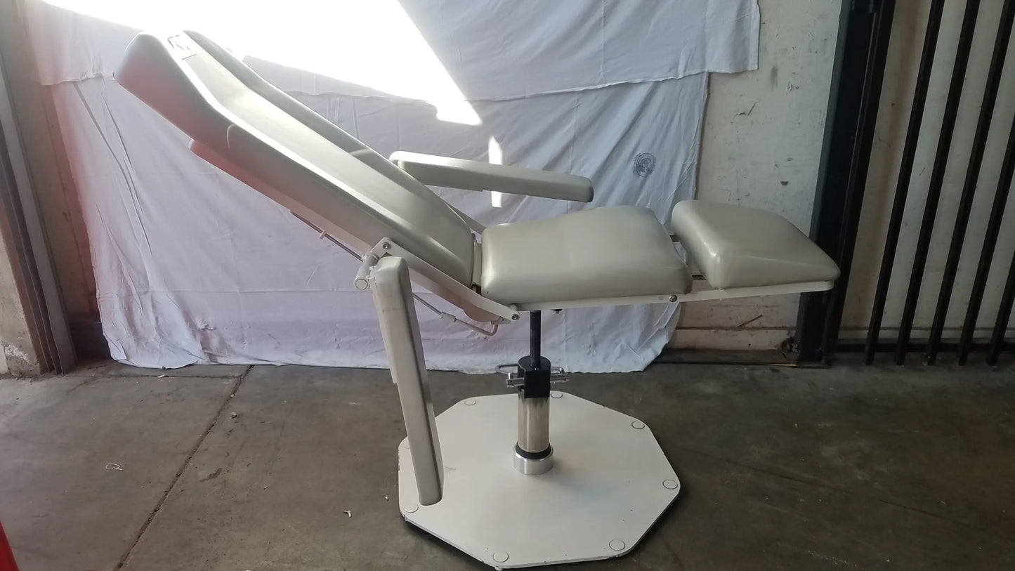 Beige upholstered UMF Medical 8675 adjustable phlebotomy chair with adjustable armrests and hexagonal base