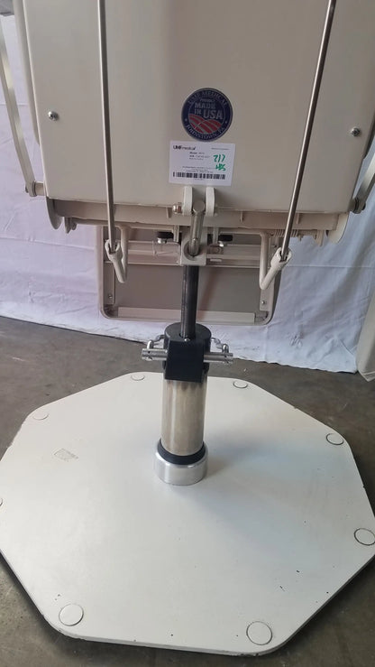 Beige UMF Medical 8675 phlebotomy chair with stainless steel central column and octagonal base adjustable examination chair
