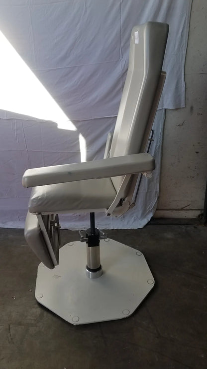 Beige upholstered umf medical 8675 phlebotomy chair with hexagonal metal base and adjustable armrests for examination