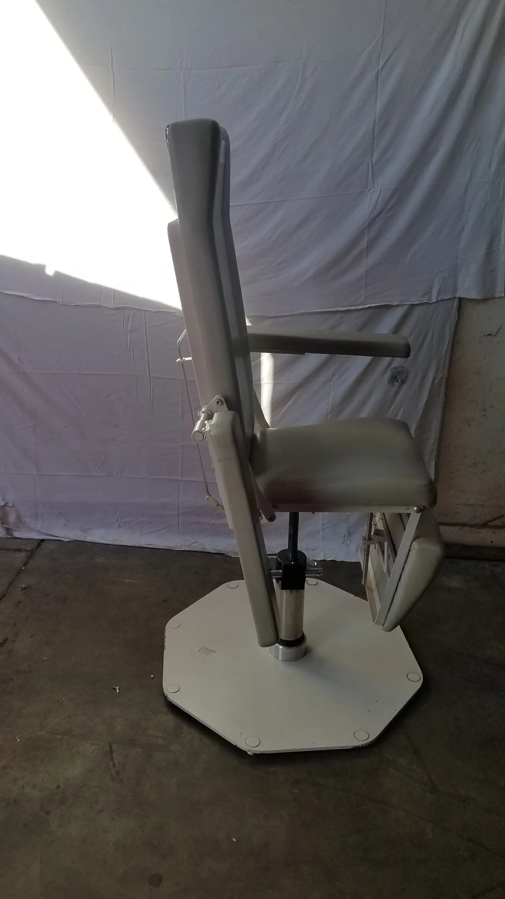 Beige upholstered UMF medical 8675 adjustable phlebotomy chair with hexagonal base and footrest for medical use