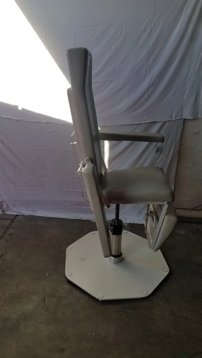 Beige upholstered UMF medical 8675 adjustable phlebotomy chair with hexagonal base and footrest for medical use