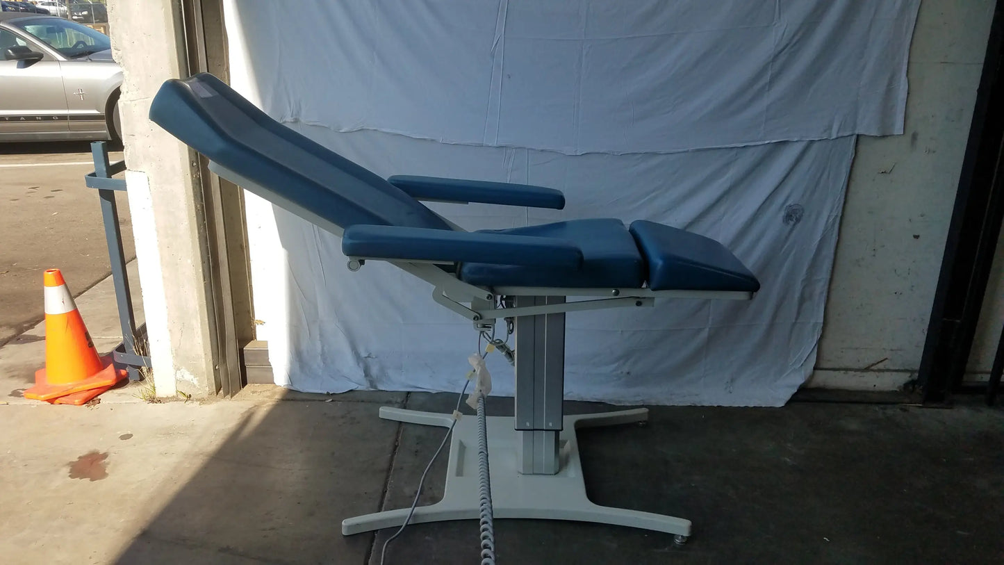 Blue padded power exam phlebotomy chair with silver metal frame and adjustable height by UMF medical equipment