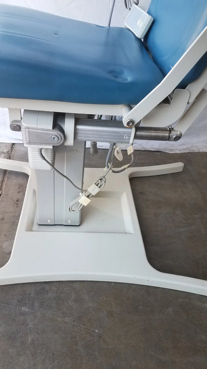 Blue upholstered UMF Medical Equipment power exam phlebotomy chair with white metal frame and hydraulic adjustment mechanism