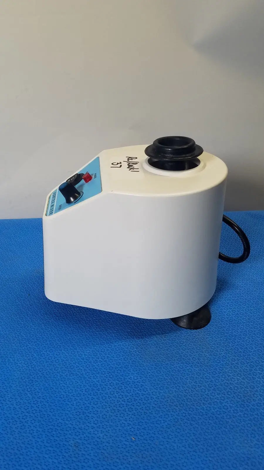 White plastic unico vortex mixer L-VM 100 with black rotor and control panel for laboratory use