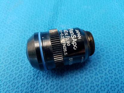 Black Nikon UPlanSApo 40x microscope objective lens with 0.90 numerical aperture and FN26.5 field number features textured focus ring