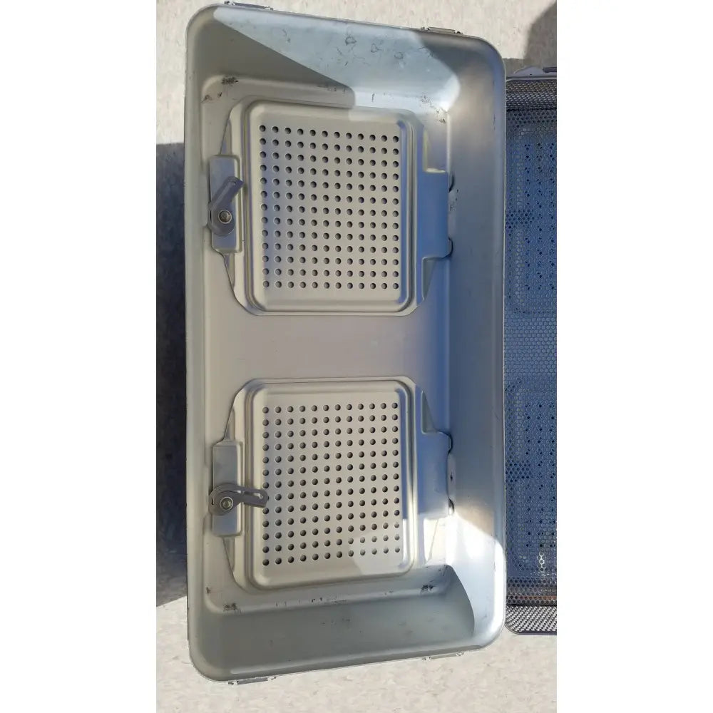 Gray plastic dincd3-5lt genesis carefusion sterilization container with two perforated compartments and secure latches