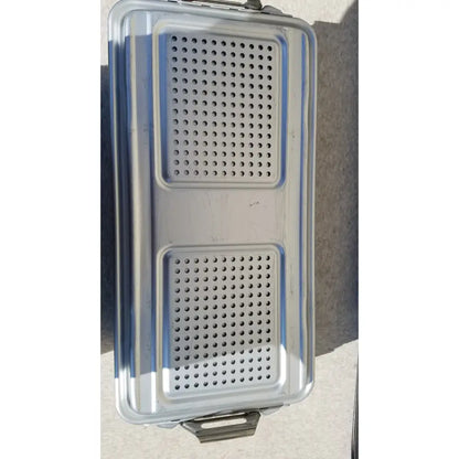 Silver stainless steel food tray with two rectangular perforated sections and reinforced edges for dincd3-5lt genesis carefusion sterilization container