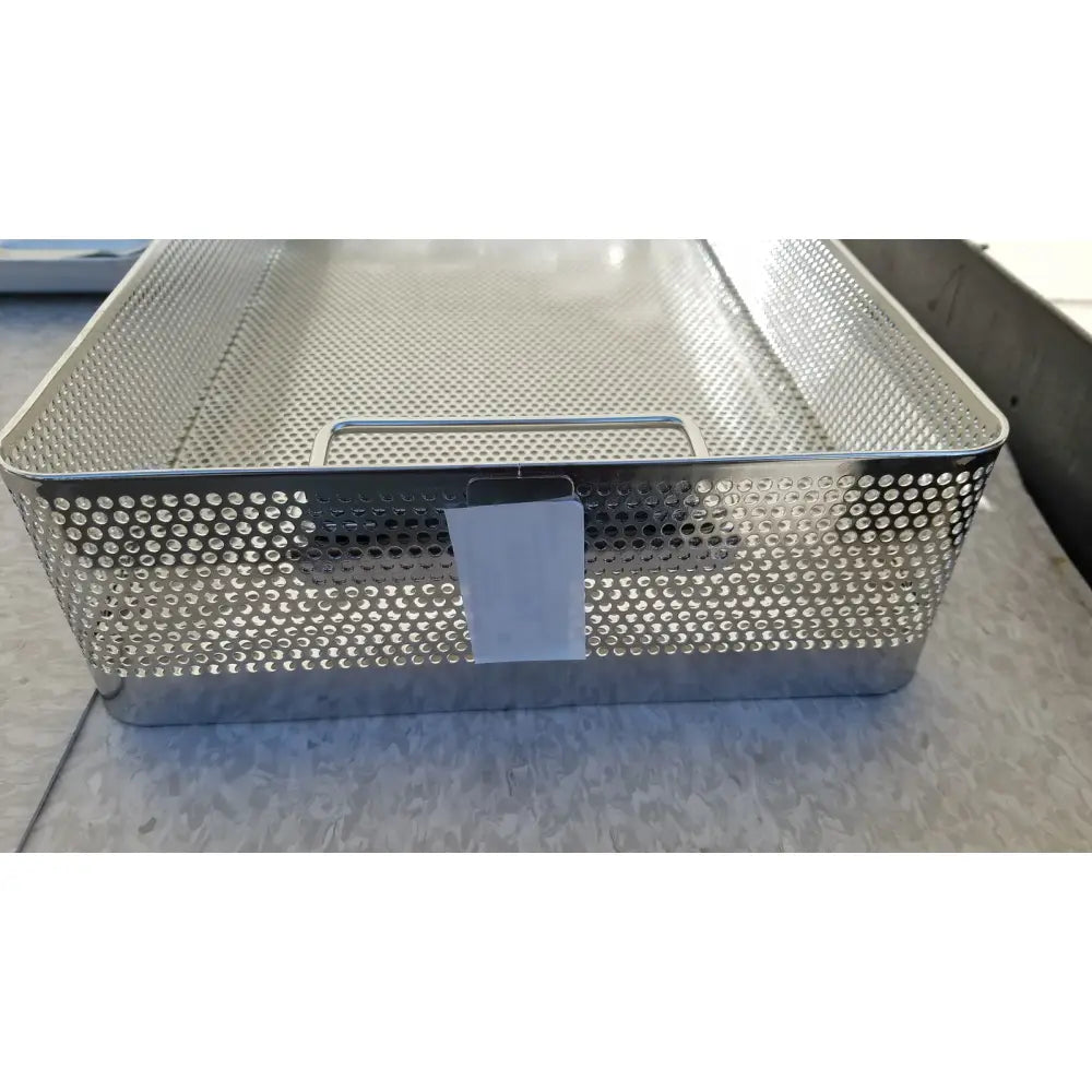 A rectangular perforated stainless steel mesh basket with handle and label for genesis carefusion dincd3-5lt sterilization container