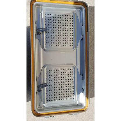 Silver metal baking tray with two perforated compartments and yellow edge for v.mueller dincd3-5lt genesis carefusion sterilization container