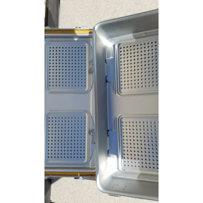 Silver metallic dincd3-5lt genesis sterilization container tray with perforated compartments and blue plastic inserts