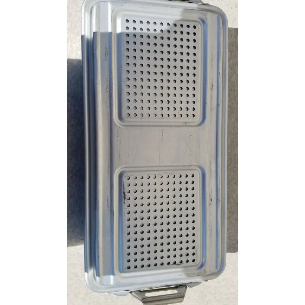 Silver metallic dincd3-5lt genesis sterilization container tray with rectangular perforations and bottom handle