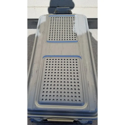Gray plastic pet carrier with blue trim and perforated sections used as genesis sterilization container dincd3-5lt model