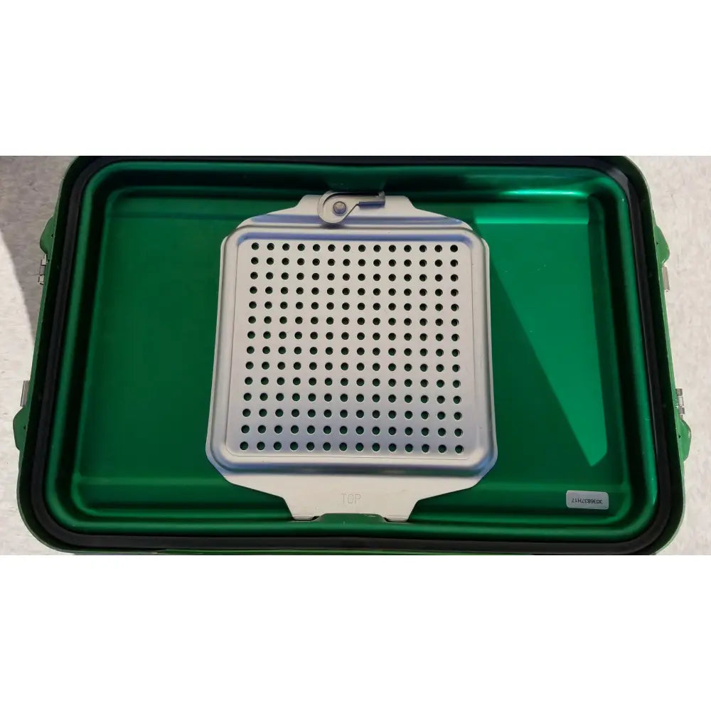 Silver perforated metal genesis carefusion sterilization container with sturdy handle and latch for secure storage