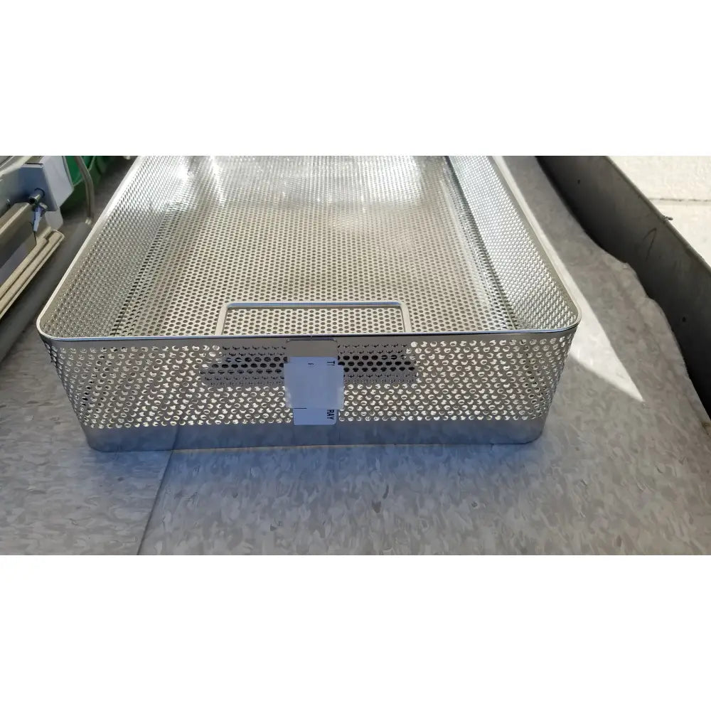 Silver metal mesh basket with handle and perforated sides in genesis carefusion sterilization container cd2-5c