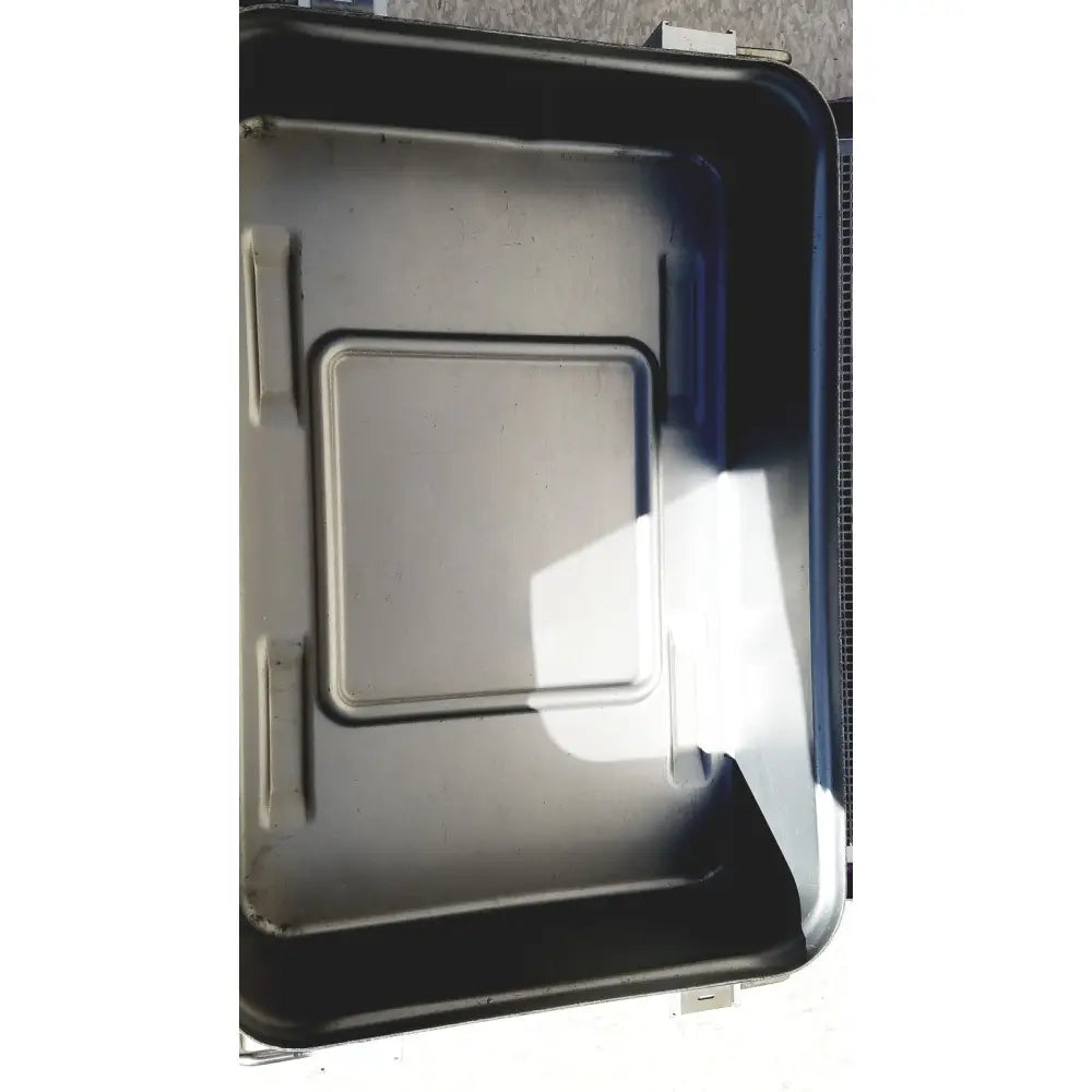 Black plastic genesis carefusion sterilization container with rectangular lid and molded handles 5 inches deep