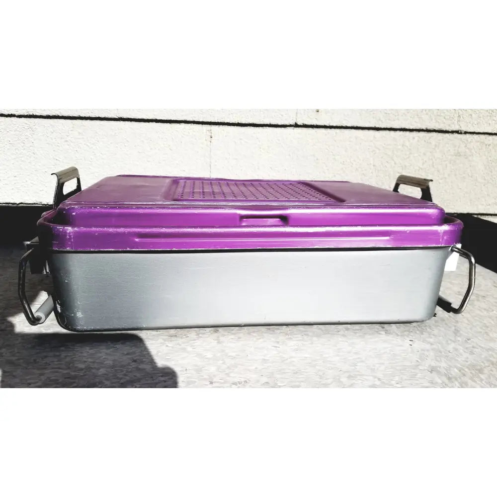 Purple and gray plastic genesis carefusion sterilization container with black metal handles 5 inch deep storage bin
