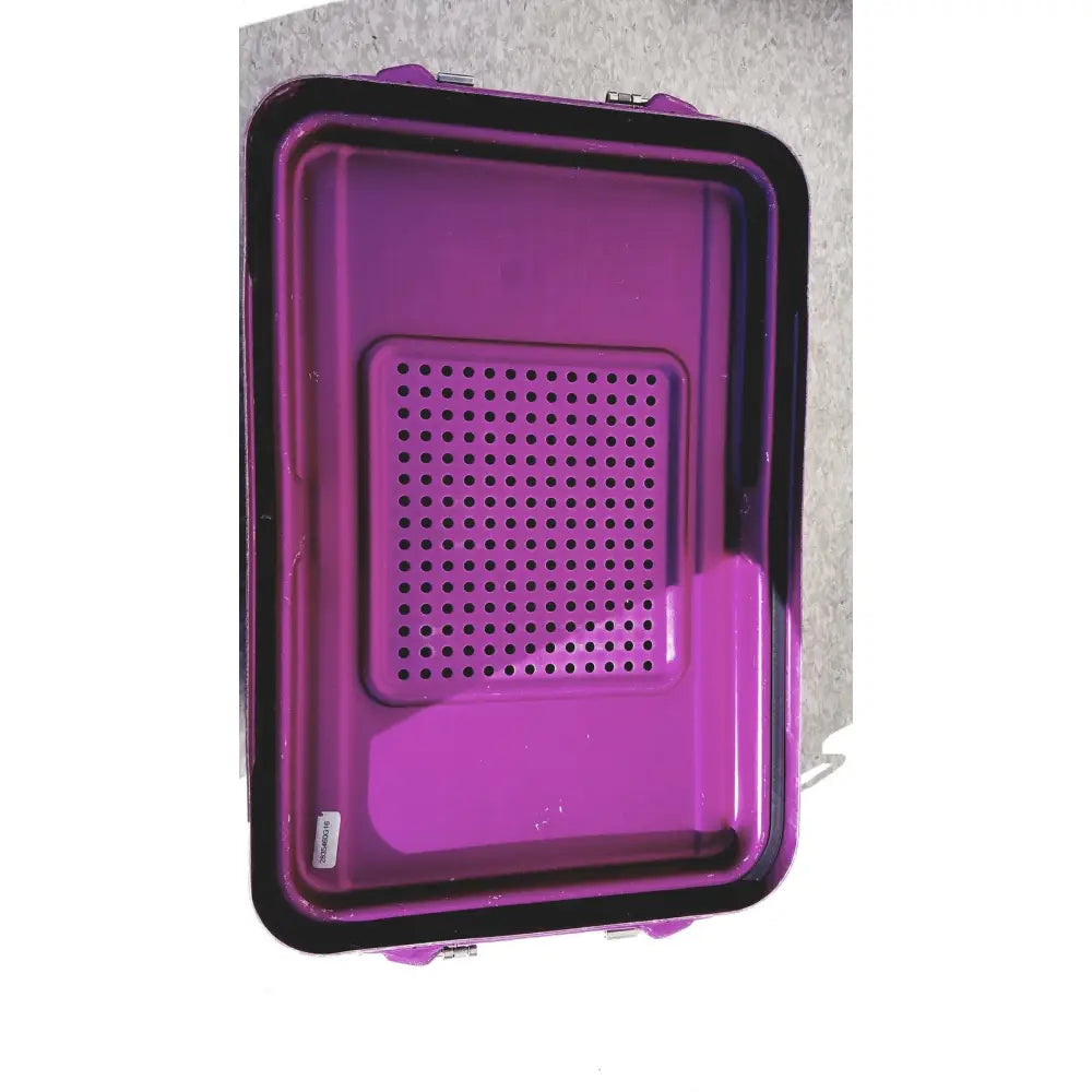Purple plastic genesis carefusion sterilization container with perforated panel and black trim, 5 inch deep for medical use