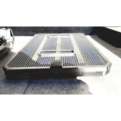 Black mesh laptop cooling pad with central vent and side grilles shown with genesis carefusion sterilization container 5 deep