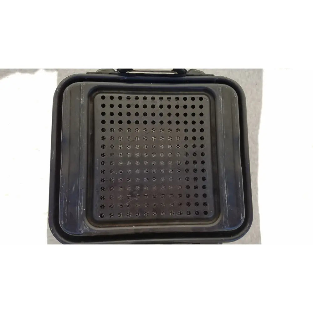 Black plastic tool tray with circular perforations and molded handle for genesis carefusion sterilization container use